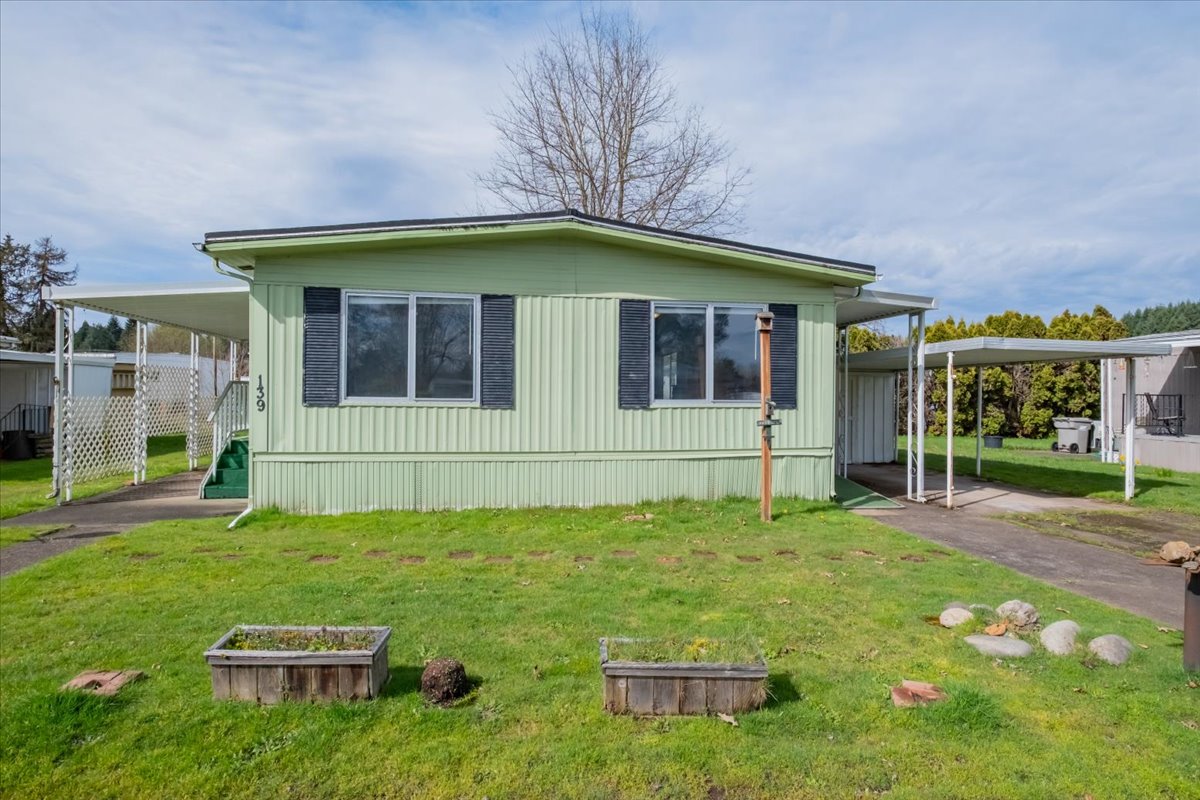green mobile home set on grass